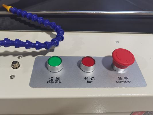Macchina automatica per sigillare e tagliare pellicole a manicotto per imballaggi a pellicola di cartone