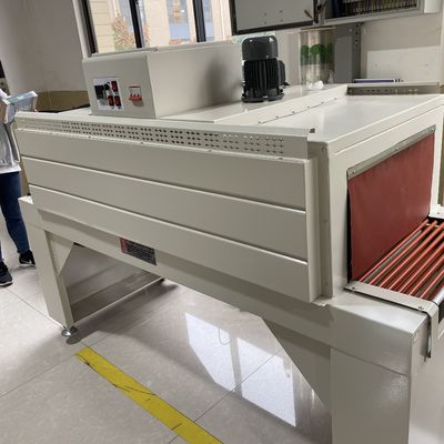 Macchina di confezionamento a pellicola termico completamente automatica e galleria di contrazione per l' imballaggio dei contenitori